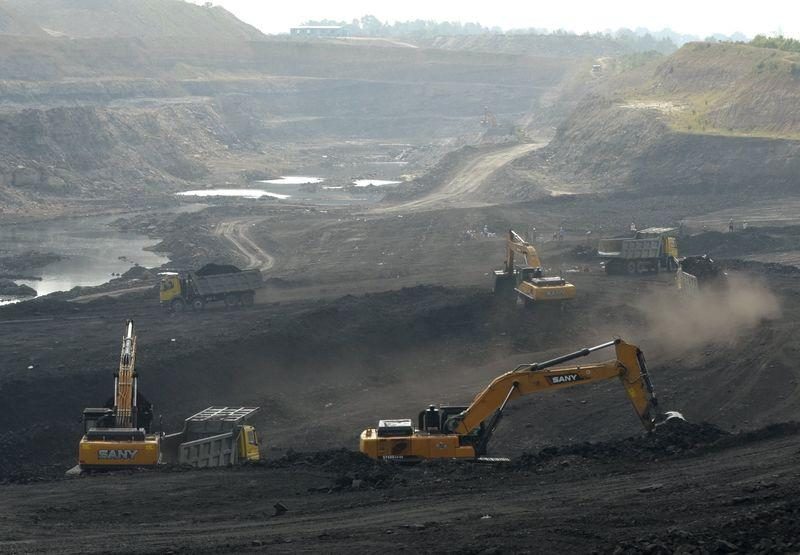 Miners work at Magadh coal mine in Chatra district