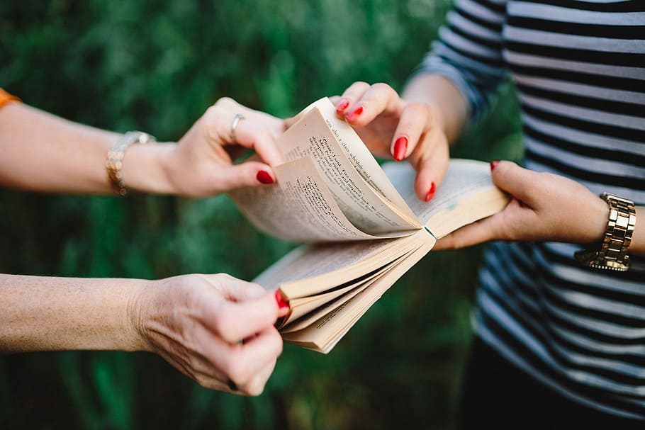 book-hands-women-girls